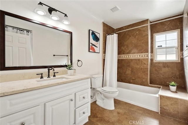 full bathroom featuring vanity, toilet, and shower / tub combo