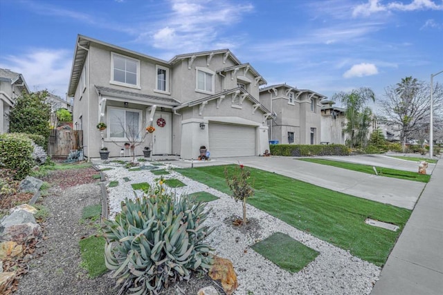 view of front of house with a garage and a front yard