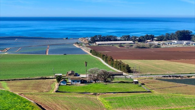 aerial view with a water view and a rural view