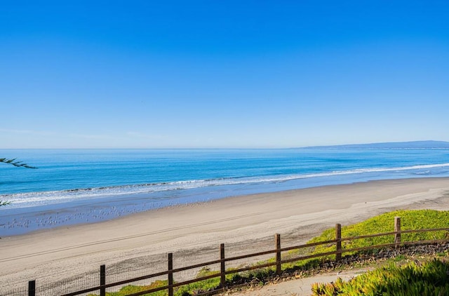 property view of water featuring a beach view