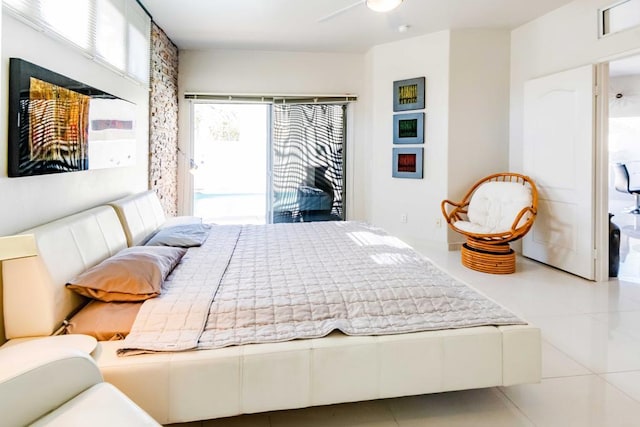 bedroom with ceiling fan, access to exterior, and tile patterned flooring