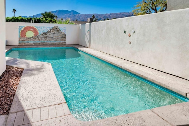 view of pool with a mountain view