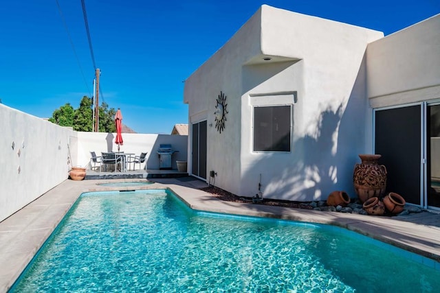 view of pool with a patio area