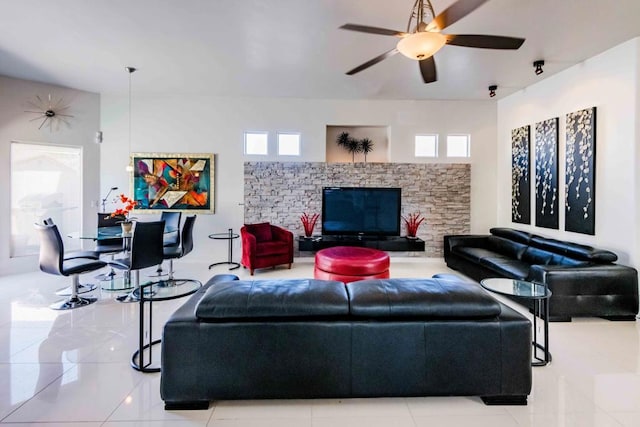 living room featuring ceiling fan and light tile patterned floors