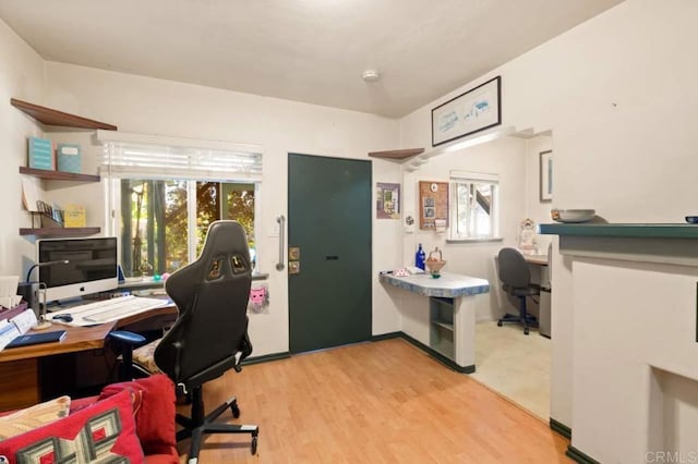 home office with light wood-type flooring