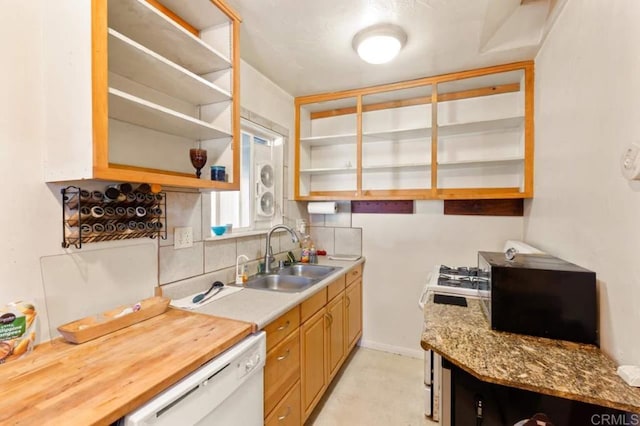 kitchen featuring sink, backsplash, butcher block counters, and dishwasher