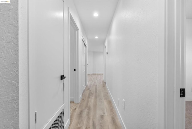 hall featuring light hardwood / wood-style flooring