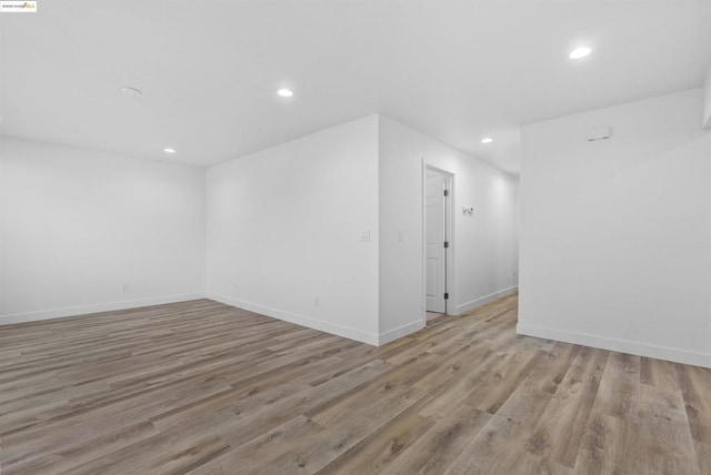 spare room featuring light hardwood / wood-style floors