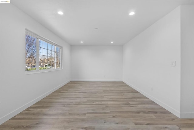 unfurnished room featuring light hardwood / wood-style floors