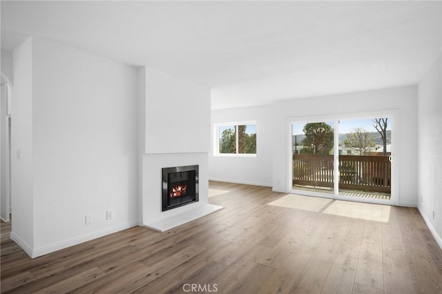 unfurnished living room with hardwood / wood-style floors