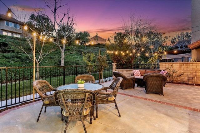 patio terrace at dusk with an outdoor hangout area