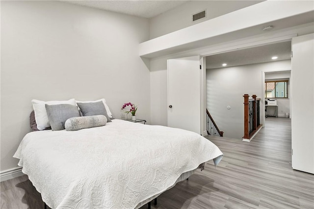 bedroom featuring hardwood / wood-style floors