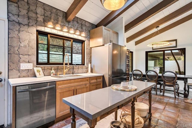 kitchen featuring light brown cabinetry, sink, tasteful backsplash, lofted ceiling with beams, and stainless steel appliances