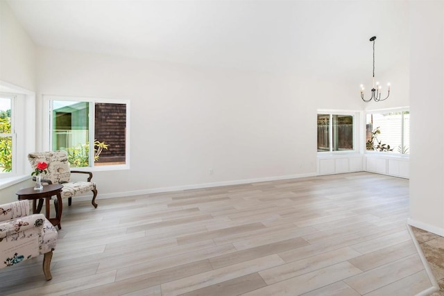 interior space featuring light hardwood / wood-style flooring and a chandelier