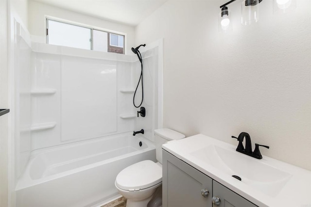 full bathroom with vanity, tub / shower combination, and toilet