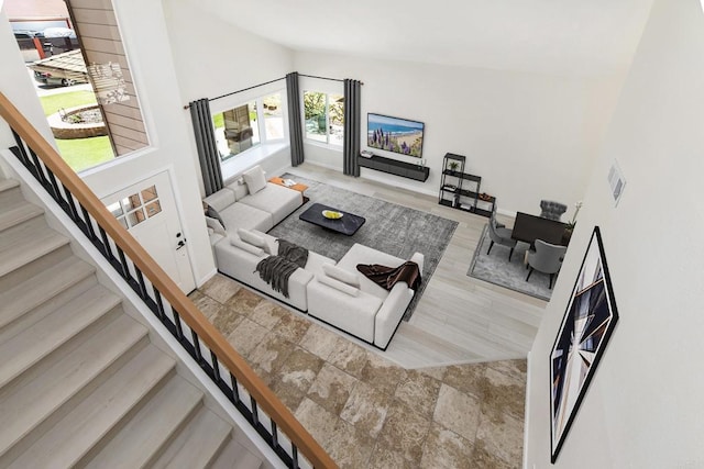 living room featuring a high ceiling