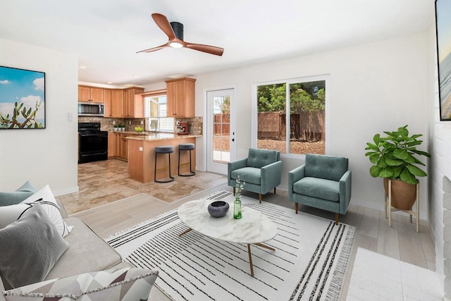 living room featuring ceiling fan