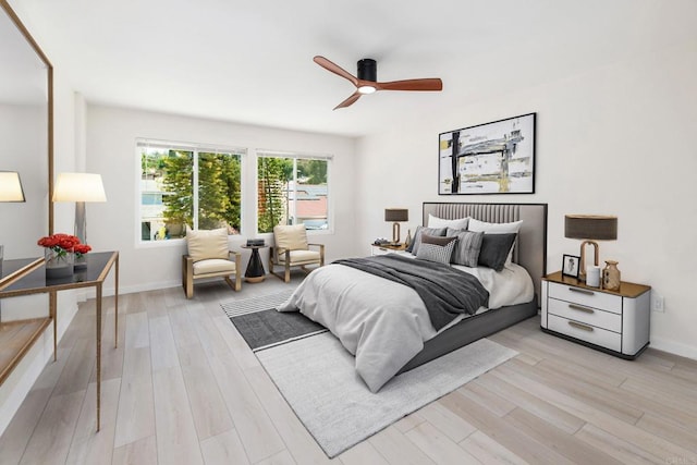 bedroom featuring light hardwood / wood-style flooring and ceiling fan