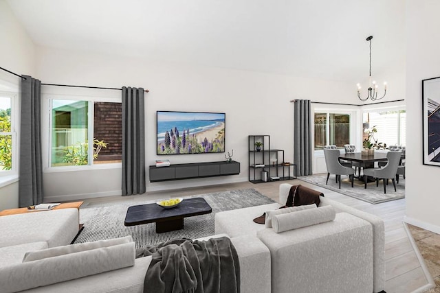 living room featuring light hardwood / wood-style floors and a chandelier