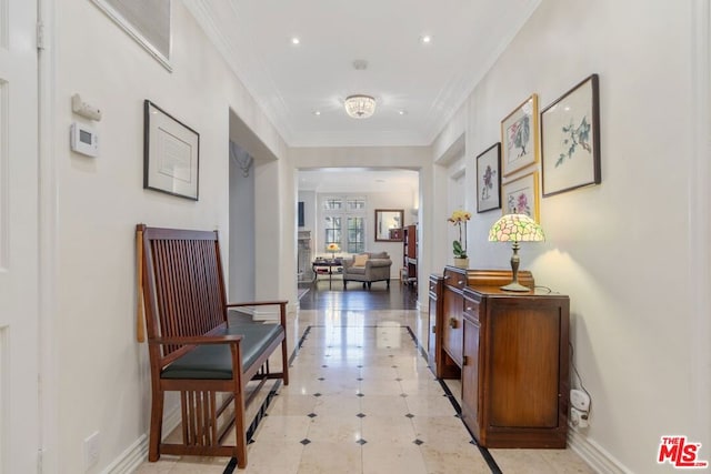 hallway featuring crown molding