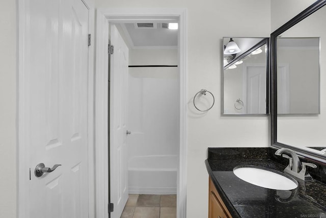 bathroom featuring vanity, bathtub / shower combination, and tile patterned floors