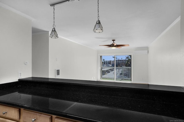 interior space with decorative light fixtures, a wall unit AC, crown molding, and ceiling fan