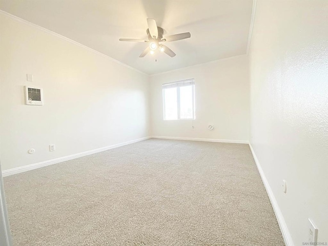 unfurnished room with carpet floors, ceiling fan, and ornamental molding