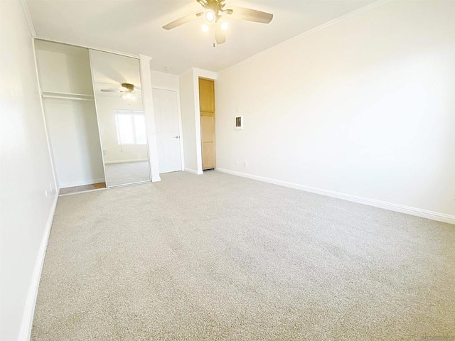 unfurnished bedroom featuring carpet flooring, a closet, and ceiling fan