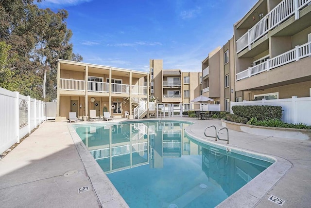 view of swimming pool with a patio