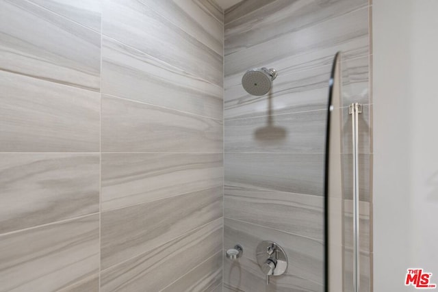 room details with a tile shower