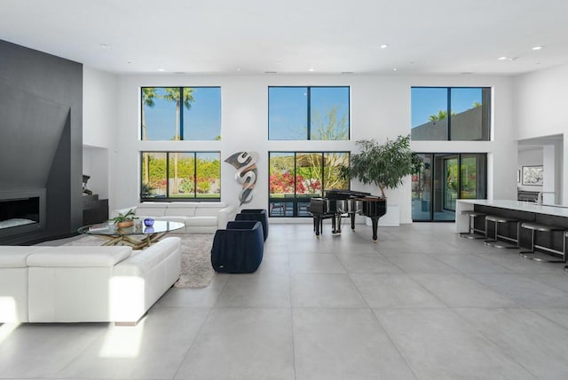 living room featuring a towering ceiling