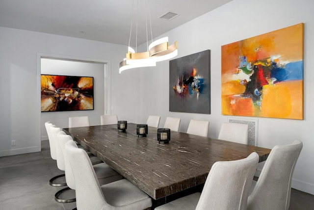 dining area featuring concrete floors