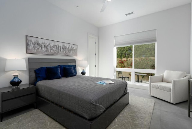 bedroom featuring ceiling fan and concrete flooring