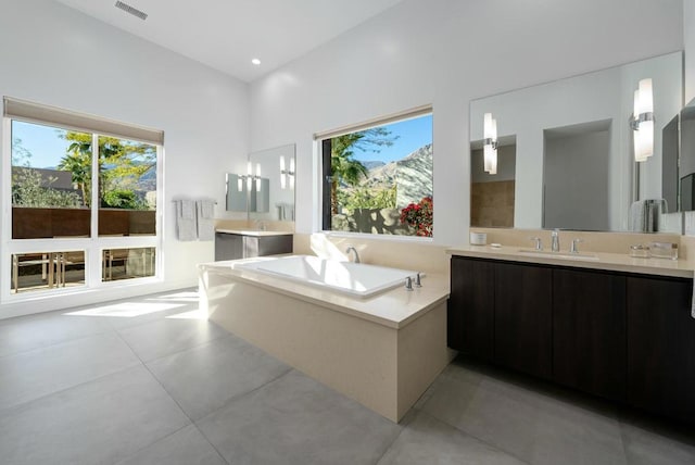 bathroom featuring a tub and vanity