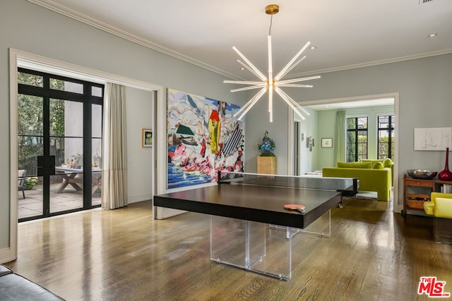 recreation room with french doors, an inviting chandelier, crown molding, and wood-type flooring