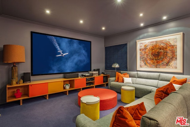 carpeted cinema room featuring crown molding