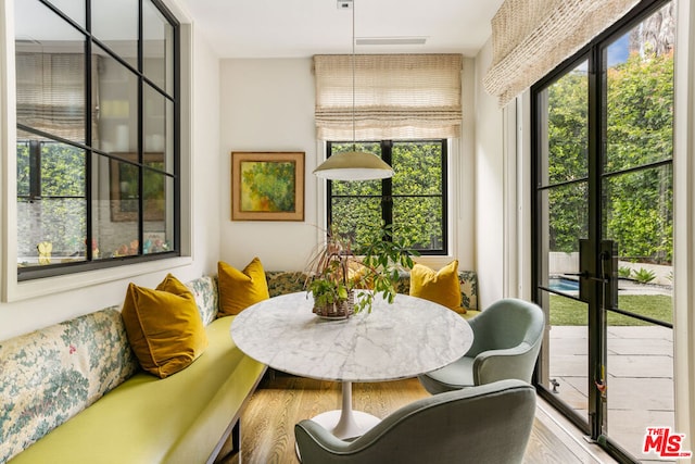 sunroom featuring breakfast area