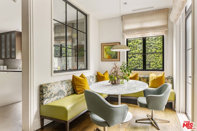 dining area featuring tile patterned floors and breakfast area