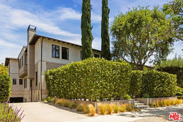 view of side of property with a garage