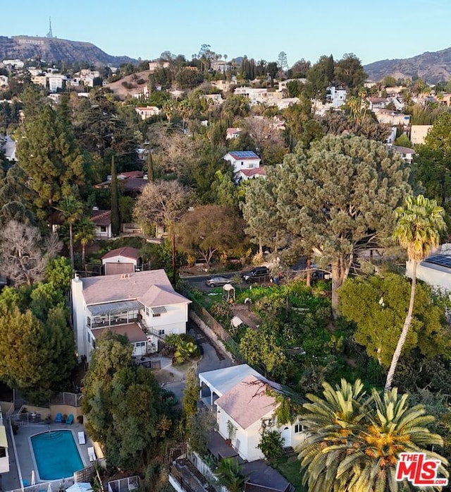 birds eye view of property featuring a mountain view