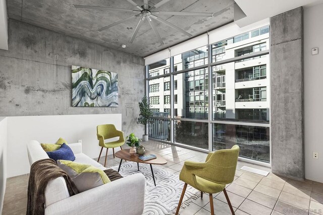 interior space featuring a wall of windows and light tile patterned floors