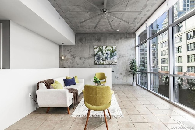 sitting room featuring floor to ceiling windows