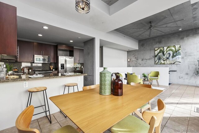 dining space with ceiling fan