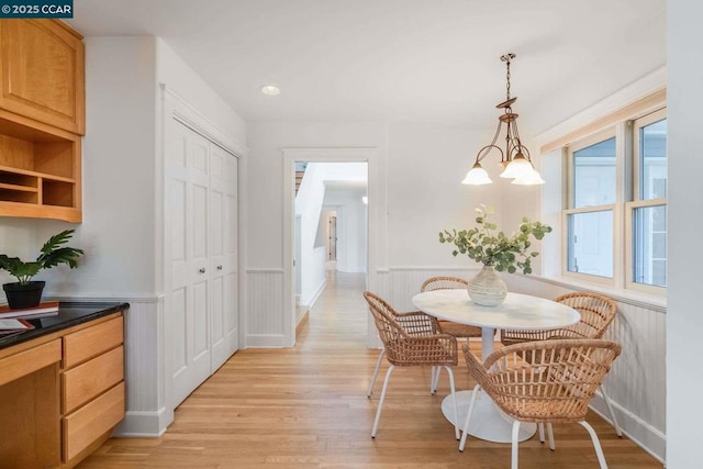 dining space featuring a chandelier and light hardwood / wood-style flooring