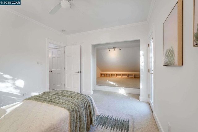 bedroom featuring ceiling fan, a closet, ornamental molding, and carpet flooring