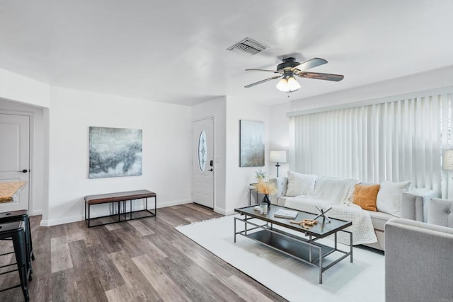 living room with ceiling fan, hardwood / wood-style floors, and a healthy amount of sunlight