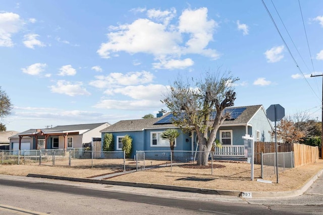 ranch-style house featuring solar panels