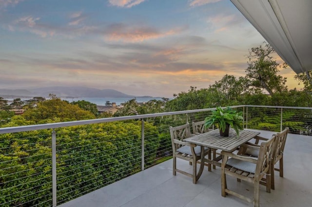 view of balcony at dusk