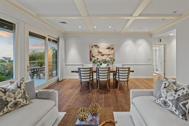 living room featuring beamed ceiling, coffered ceiling, hardwood / wood-style floors, and crown molding