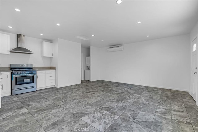 74357437 Balcom Ave, Reseda, CA 91335 - kitchen with gas range, wall chimney range hood, white cabinets, recessed lighting, and an AC wall unit